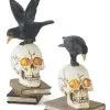 K&K Interiors Set Of 2 Resin LED Skull On Books With Crow Halloween Figurines Decoration